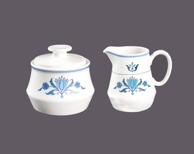Noritake Blue Haven stoneware creamer and covered sugar bowl made in Japan.