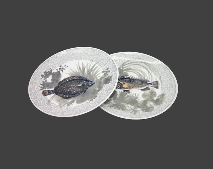 Pair of Kahla salad plates. Two different fish in black on green. Made in Germany.