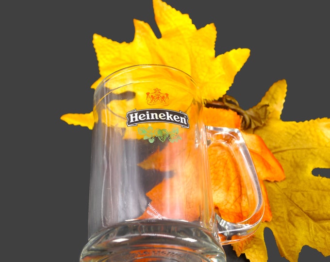 Heineken half-pint handled stein. Etched-glass branding, weighted base.