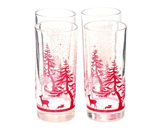 Four Christmas tumblers. Etched-glass Christmas Woodland theme red deer, trees, bunnies. Attributed to Pfaltzgraff.