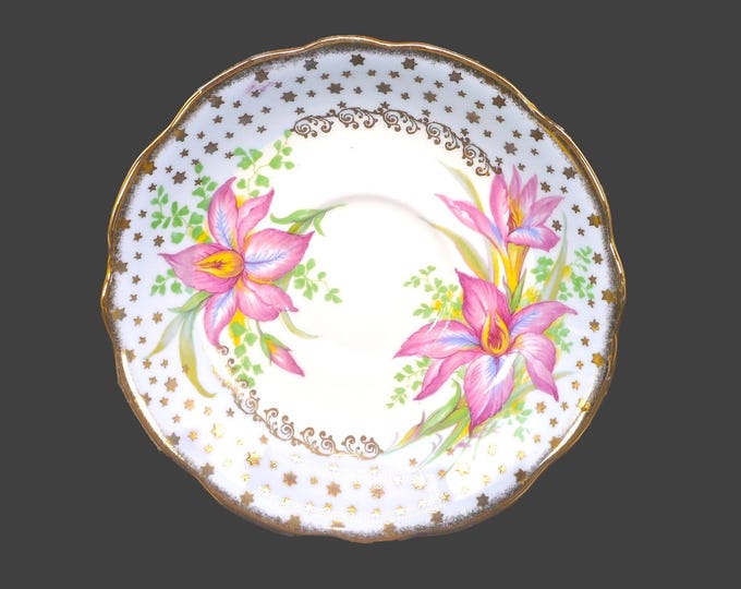 Foley orphaned saucer only. Robin's egg blue, pink iris florals, gold stars. Made in England.