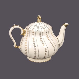 Vintage Sadler 3403 teapot made in England. Gold florals. Flaws.