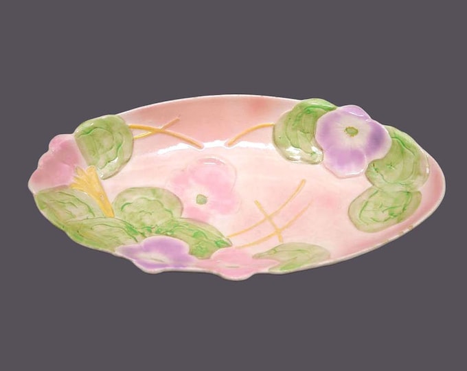 Avon Ware flower-shaped relish or cranberry dish. Pink, purple flowers made in England. Flaws (see below).
