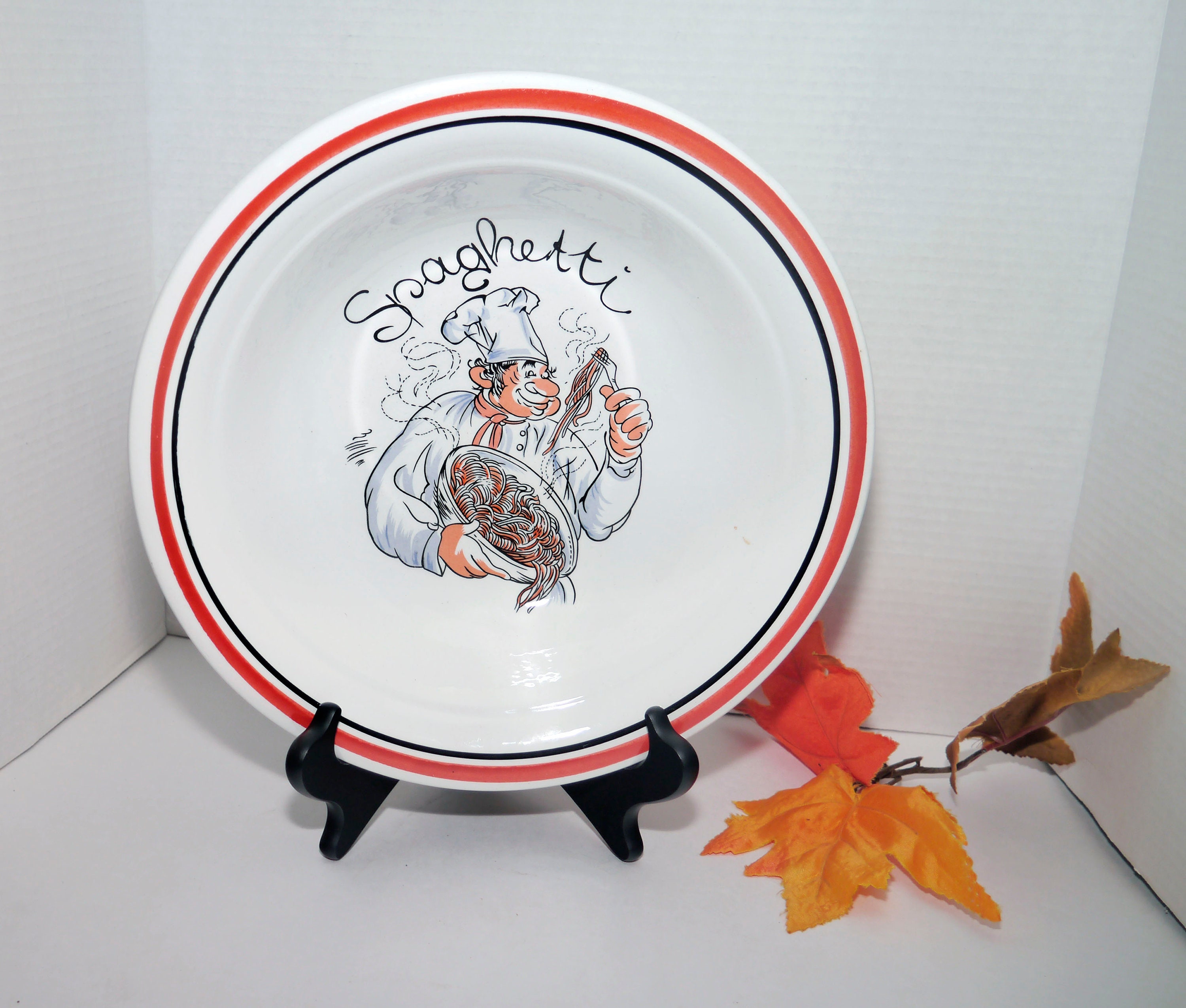 Round pasta serving bowl made in Korea by Sabre. Central Spaghetti chef and wording, red black