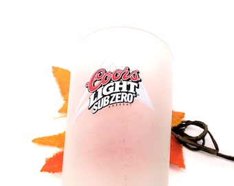 Coors Light Sub Zero "The Silver Bullet" beer pint glass. Frosted with etched-glass branding.
