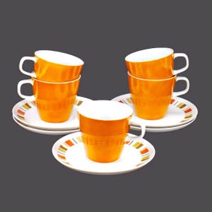 Five mismatched Mikasa Persimmon cups Mikasa Harmony saucers made in Japan.