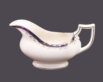 Royal Crownford cobalt and filigree gravy boat only made in England. Flaw (see below).