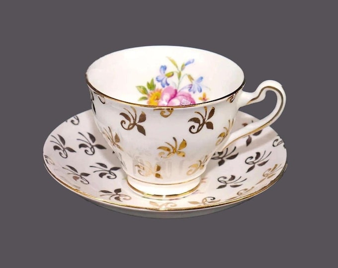 Clare Bone China cup and saucer set made in England. Gold Fleur de Lys, pink roses, multicolor florals, gold edge.