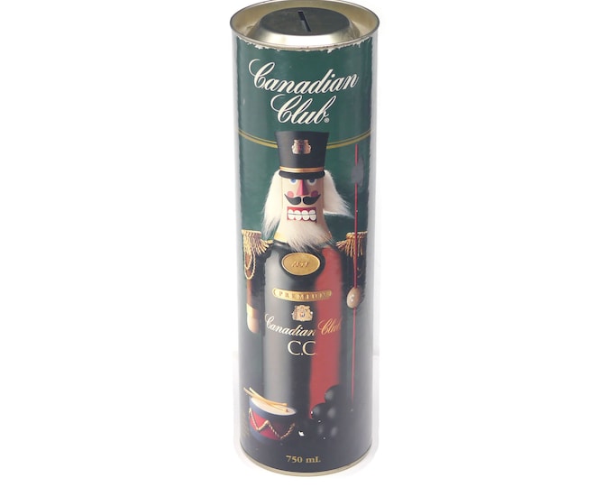 Canadian Club Whisky collectible coin bank tin featuring the Christmas Nutcracker.