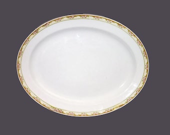 Antique art-nouveau period Globe Pottery oval meat platter. Pink roses, greenery, yellow band, Made in England.