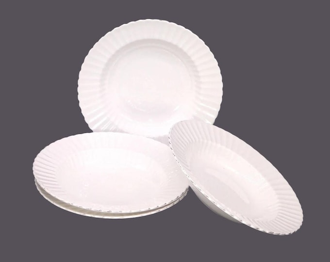 Four Paragon 497 | 498 rimmed soup bowls made in England. Chef's favorite all-white bone china.