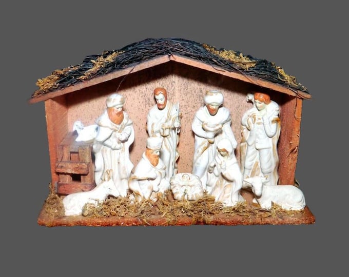 Nativity Set | creche scene. Ten porcelain figures wooden shed thatched roof. Figures are fixed in place. EBCI Imports.