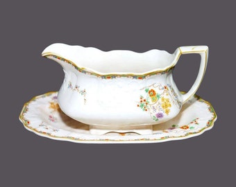 Myott Sunshine Susie gravy boat with oval under-plate made in England. Flaw (see below).