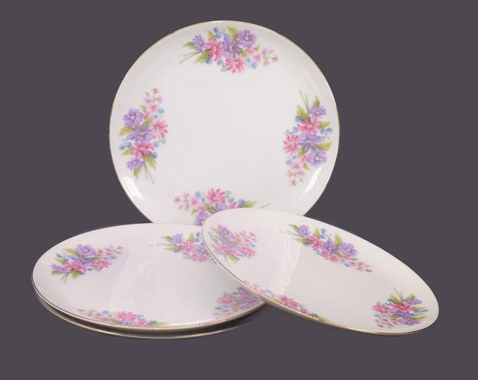Four Leuco Fine China luncheon plates. Pink, purple florals, smooth gold edge. Made in Japan.