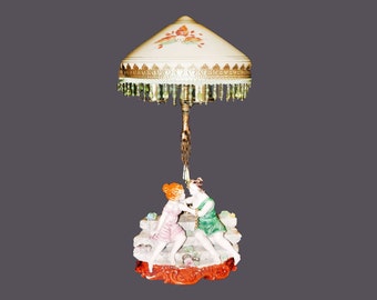 Capodimonte figural table lamp with Murano glass shade. The Kiss. Young Lovers engaged in near kiss. Beaded glass fringe.