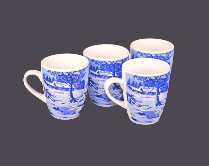 Four Currier & Ives Christmas ceramic coffee or tea mugs.