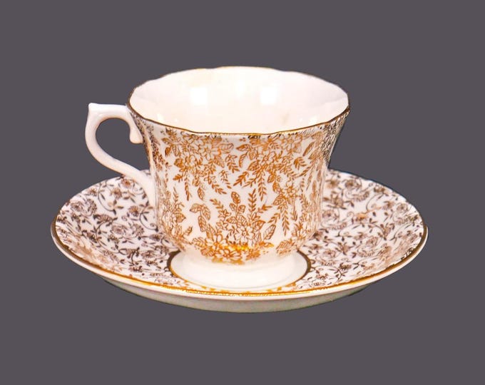 Mismatched gold chintz tea set of Royal Vale cup and Windsor Bone China saucer made in England.