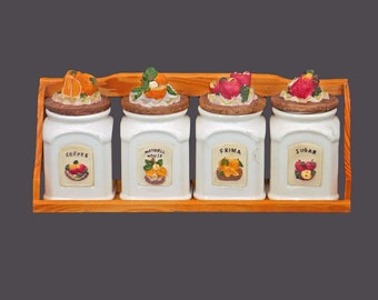 Four majolica fruit canisters with wooden rack. Maxwell House, Frima, Coffee, Sugar. Vacuum-seals.