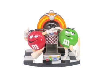 M&Ms Juke Box candy dispenser. Mr. Red and Ms. Green in her go-go boots dancing it out. Too cute.