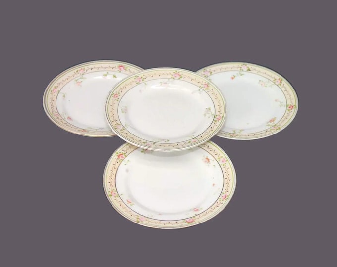 Four antique art-nouveau period hand-painted Nippon bread plates. Pink flowers. Attributed Tashiro Shoten.