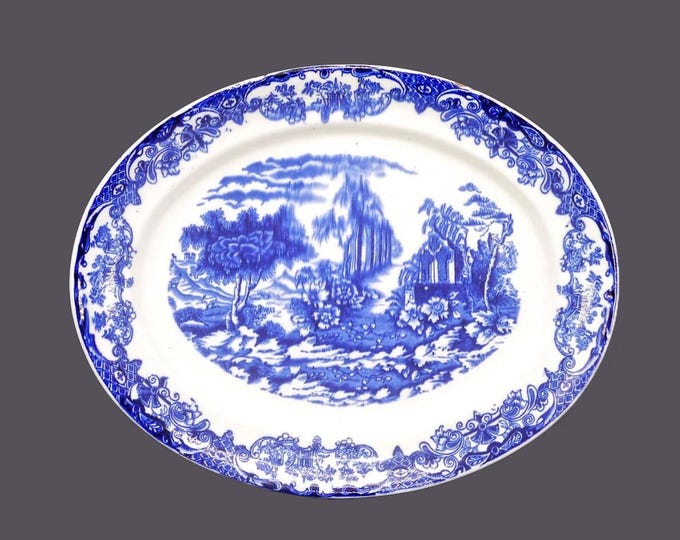 Antique flow-blue Chinoiserie platter. Attributed 19th Century England. Flaws.