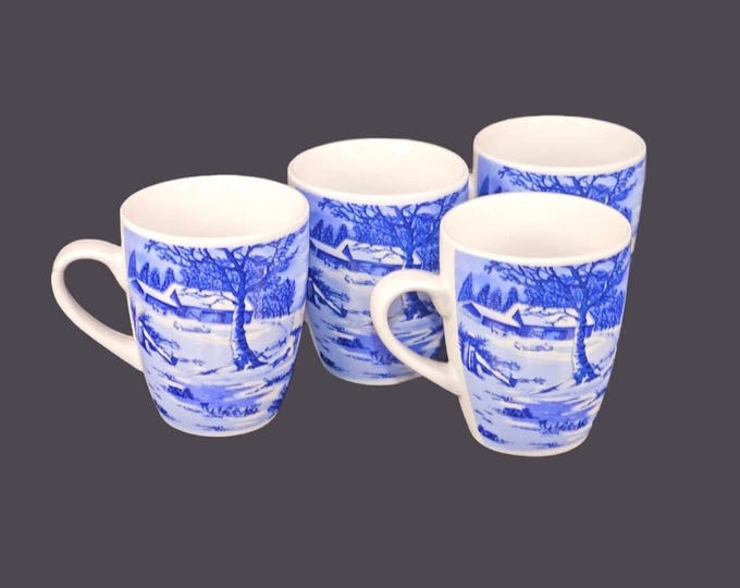 Four Currier & Ives Christmas blue-and-white coffee or tea mugs.
