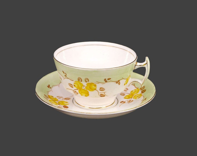 Late art-deco period Phoenix Bone China | Thomas Forester & Sons wide-mouth cup and saucer set made in England. Pale green, yellow flowers.