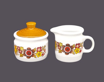 Retro vintage Myott Festival creamer and covered sugar bowl. Flaw.