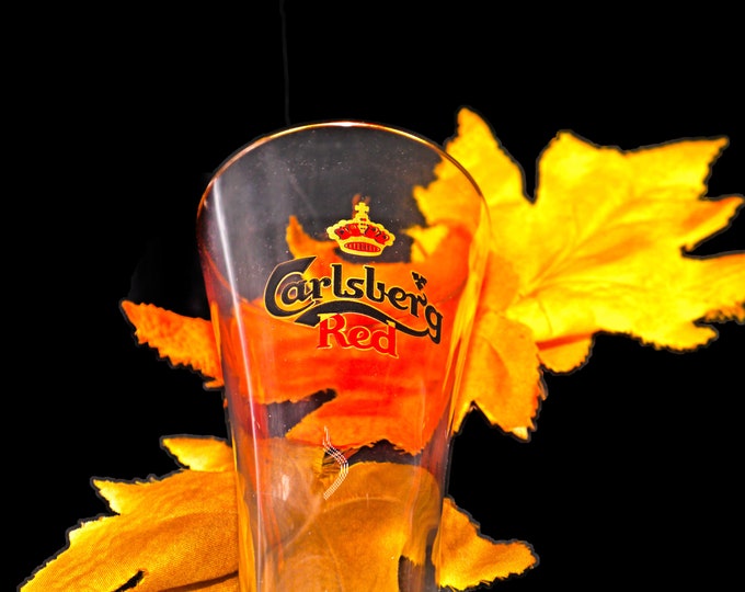 Carlsberg Red pilsner beer pint glass. Etched-glass branding, gold rim.