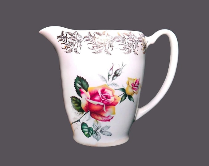Lord Nelson Pottery water, milk, iced-tea, lemonade, kool-aid pitcher. Roses, filigree. Made in England. Flaws (see below).