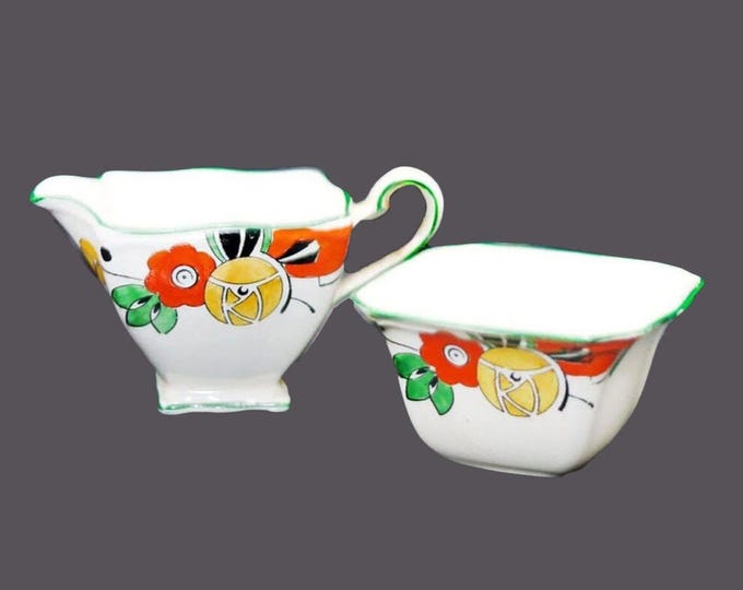 Art-deco era Royal Winton Grimwades mini creamer and open sugar bowl set made in England. Hand-painted orange yellow flowers, green trim.