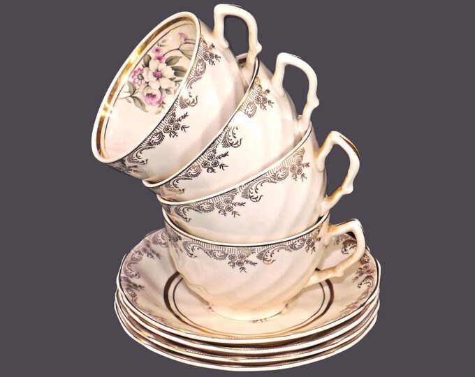 Four Sovereign Potters Windsor cup and saucer sets. Flaw (see below).