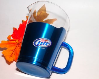 Miller Lite Beer Carolina Panthers 64 oz NFL glass and metal beer pitcher.