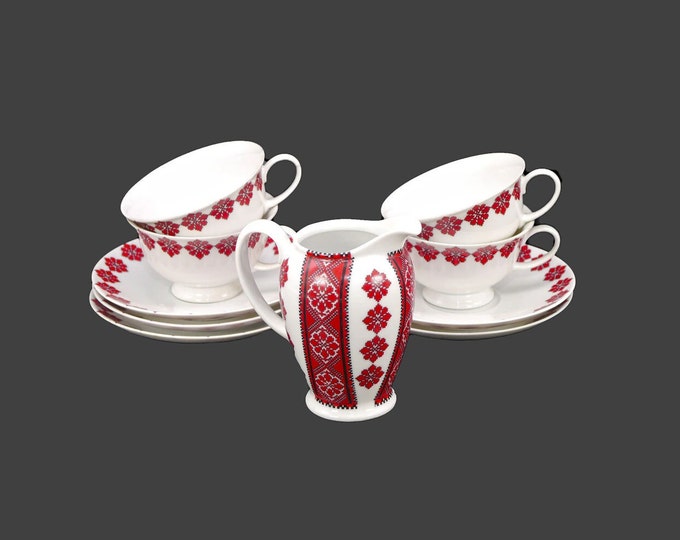 Rosenthal Classic Rose collection in traditional Ukranian motif. Four cup and saucer sets, one saucer, creamer jug. Made in Germany.