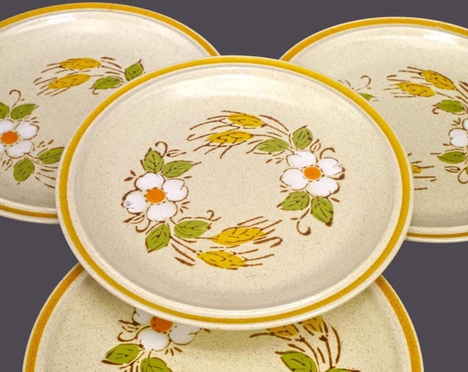 Four Hearthside Garden Festival Prairie Flowers stoneware salad plates made in Japan. Flaws (see below).