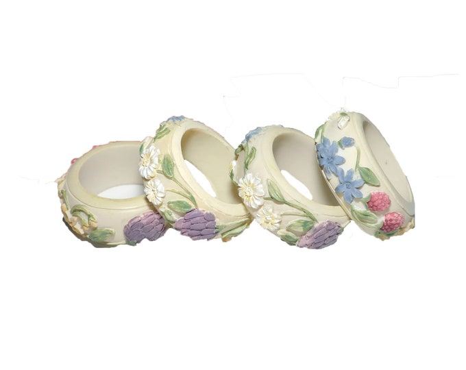 Four Capodimonte napkin rings. High-relief fruit and florals. Attributed 1980s.