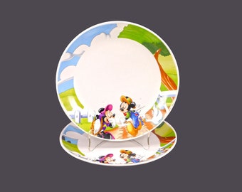 Pair of Gibson Designs GID378 Disney Mickey and Minnie Mouse dinner plates. A duck bites a hole in Mickey's trousers.