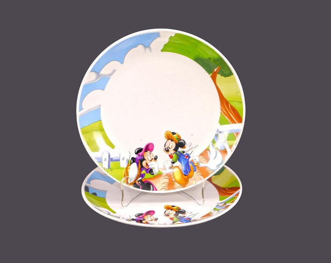 Pair of Gibson Designs GID378 Disney Mickey and Minnie Mouse dinner plates. A duck bites a hole in Mickey's trousers.