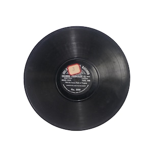 May include: A vintage black vinyl record with a label featuring text from Columbia Phonograph Co. The label includes the text "Mid the Green Field of Virginia" and "No. 259". The record is circular and has visible grooves.