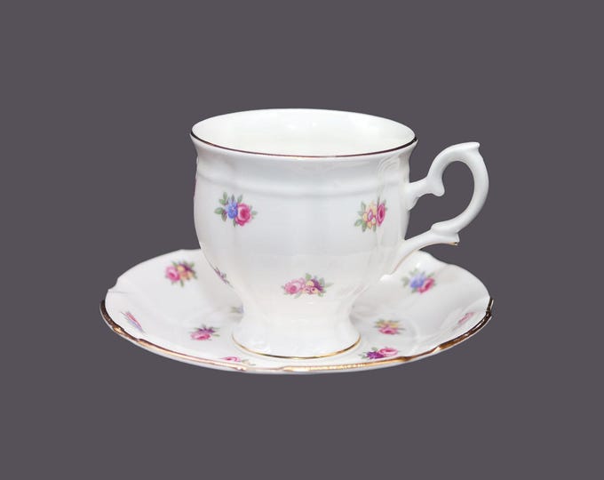 Crown Staffordshire A806 hand-decorated cup and saucer set. Bone china made in England. Floral sprays.