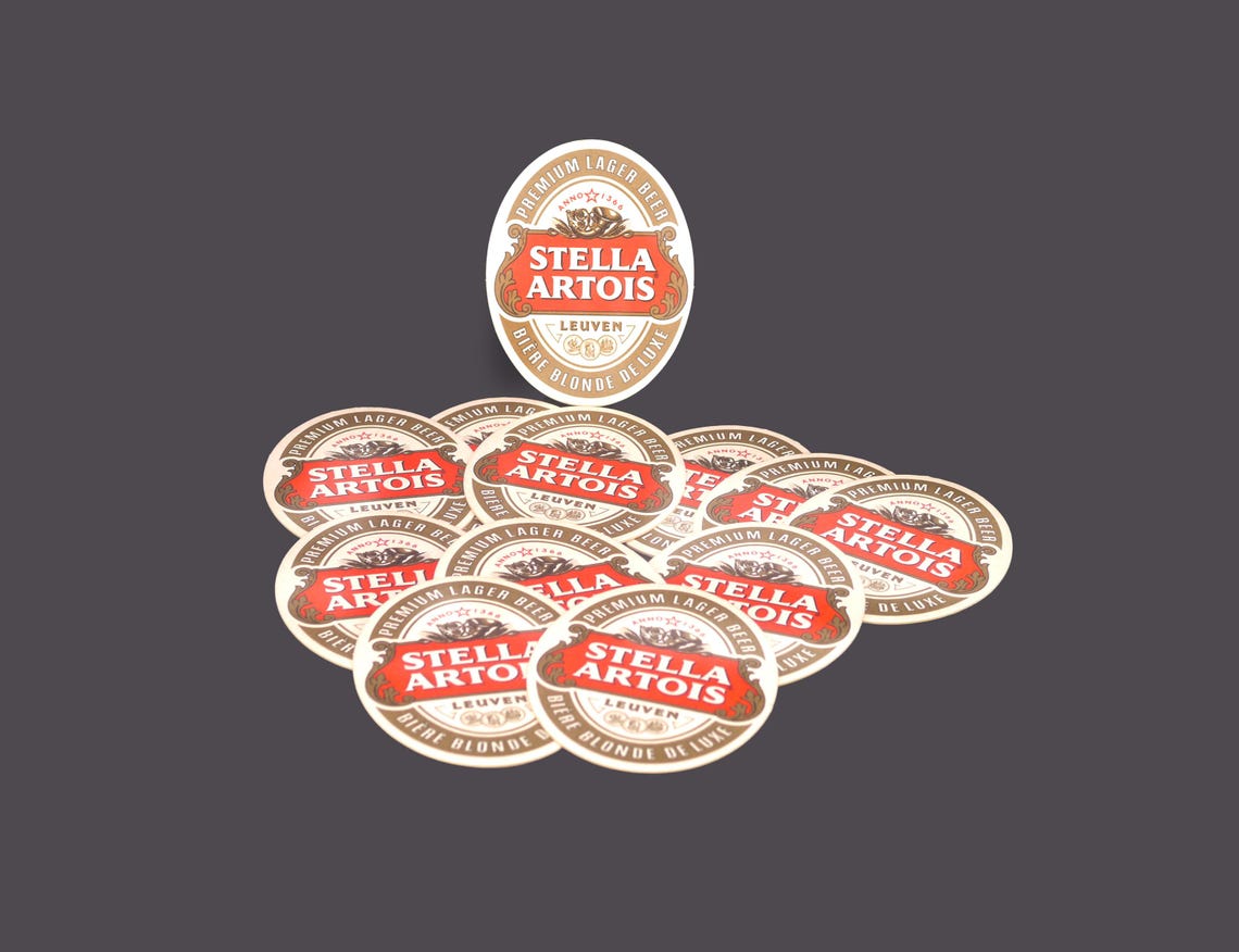 Twelve Stella Artois Biere Blonde Deluxe Oval Cardboard Coasters. Great