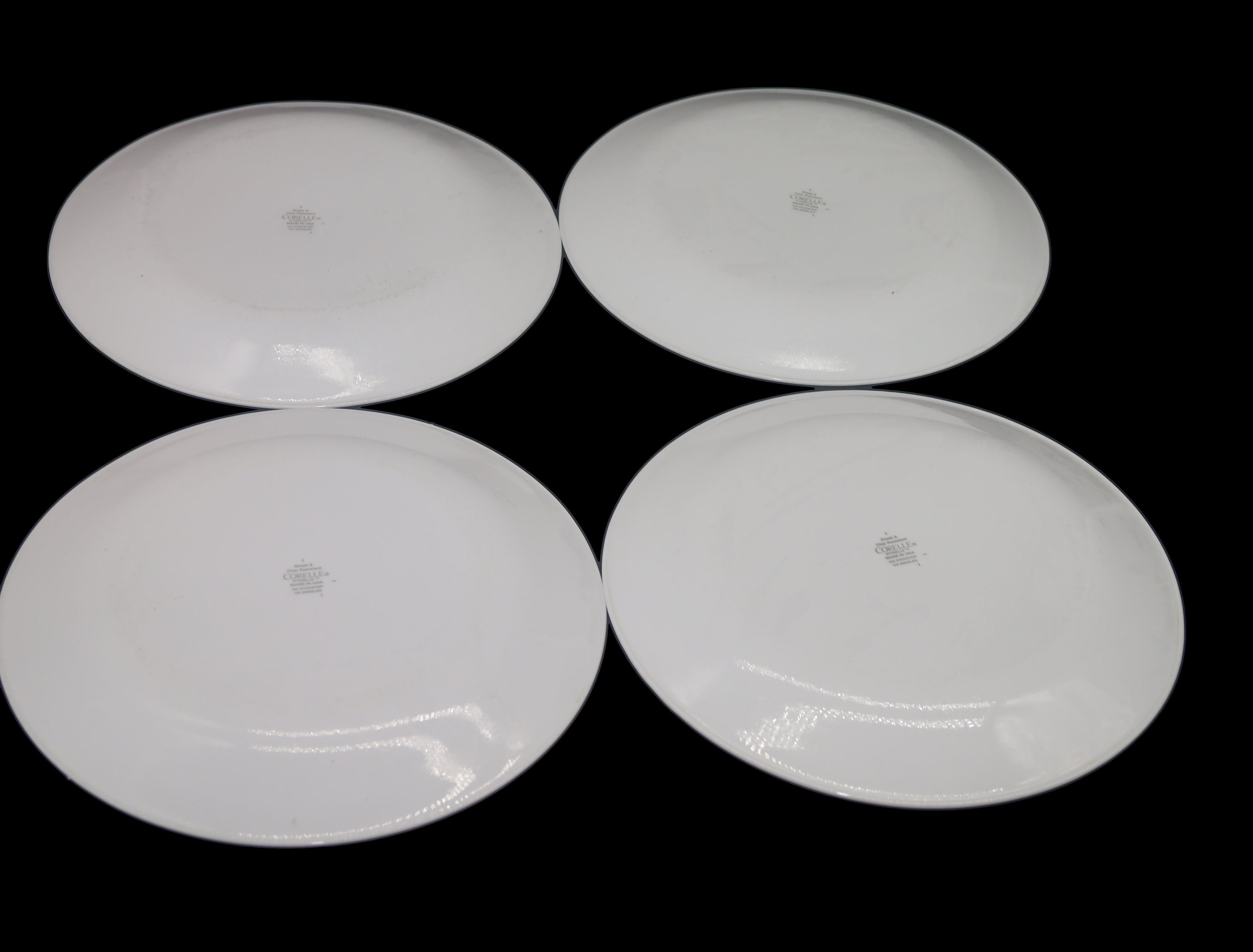 Four Corelle Corningware Circles dinner plates made in USA.