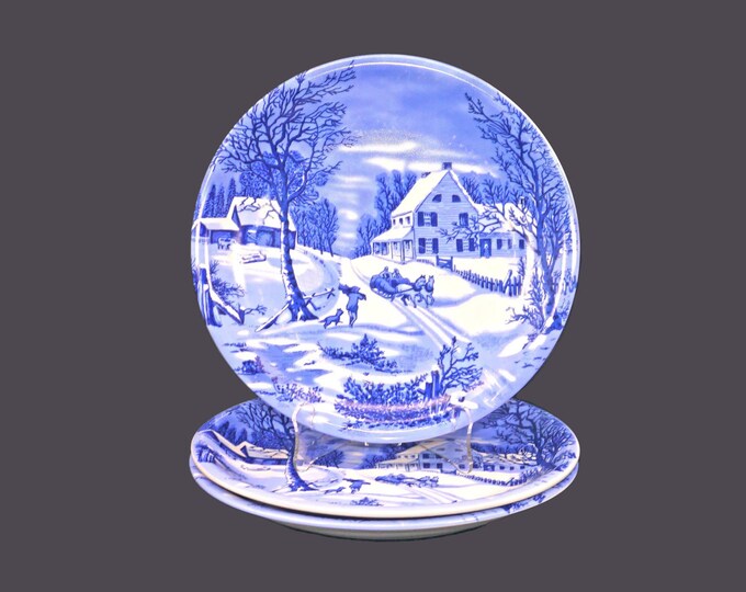 Three Currier & Ives large, blue-and-white Christmas dinner plates.