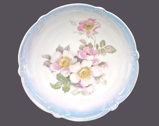 Hand-painted German lusterware serving bowl. Central florals, graduated blue luster ground, embossed perimeter details.