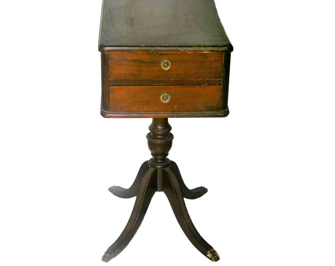 MCM solid wood Duncan Phyfe end table with two drawers, brass claw feet and pulls. Attributed Bissman.