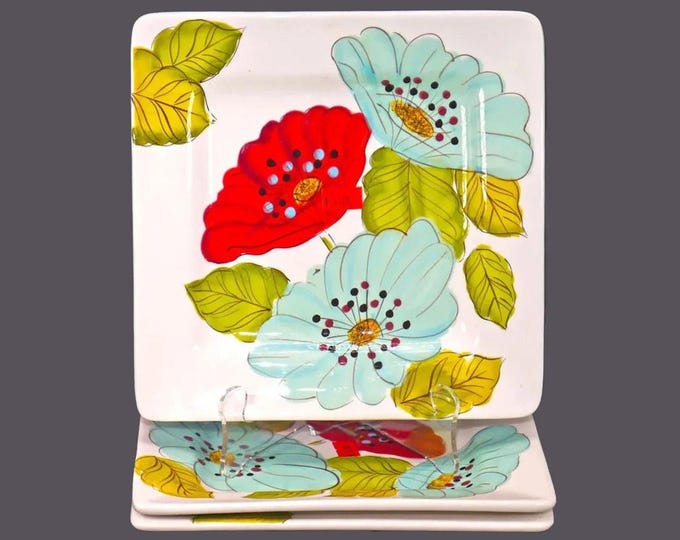 Three Laurie Gates Wildflowers square salad plates.