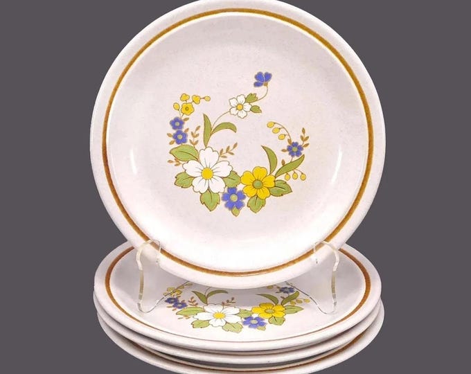 Four Nikko Mayflowers stoneware salad plates. Color Stone stoneware made in Japan. Minor flaw (see below).