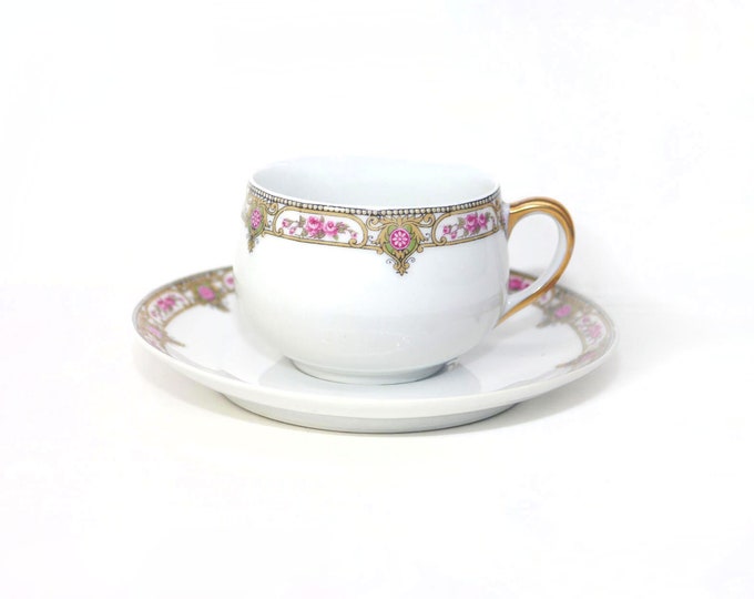 Antique Charles Ahrenfeldt Depose Limoges Classic hand-painted cup and saucer set.