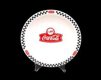 Gibson Designs Coca-Cola Town Square rimmed salad plate. Red Coke banner, cap, checked border.