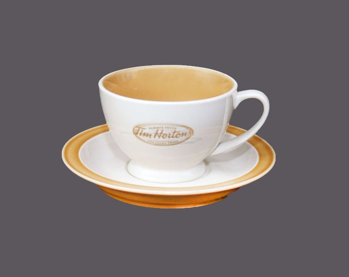 Tim Hortons ceramic cup and saucer set. Old logo, colors of gold and cream.